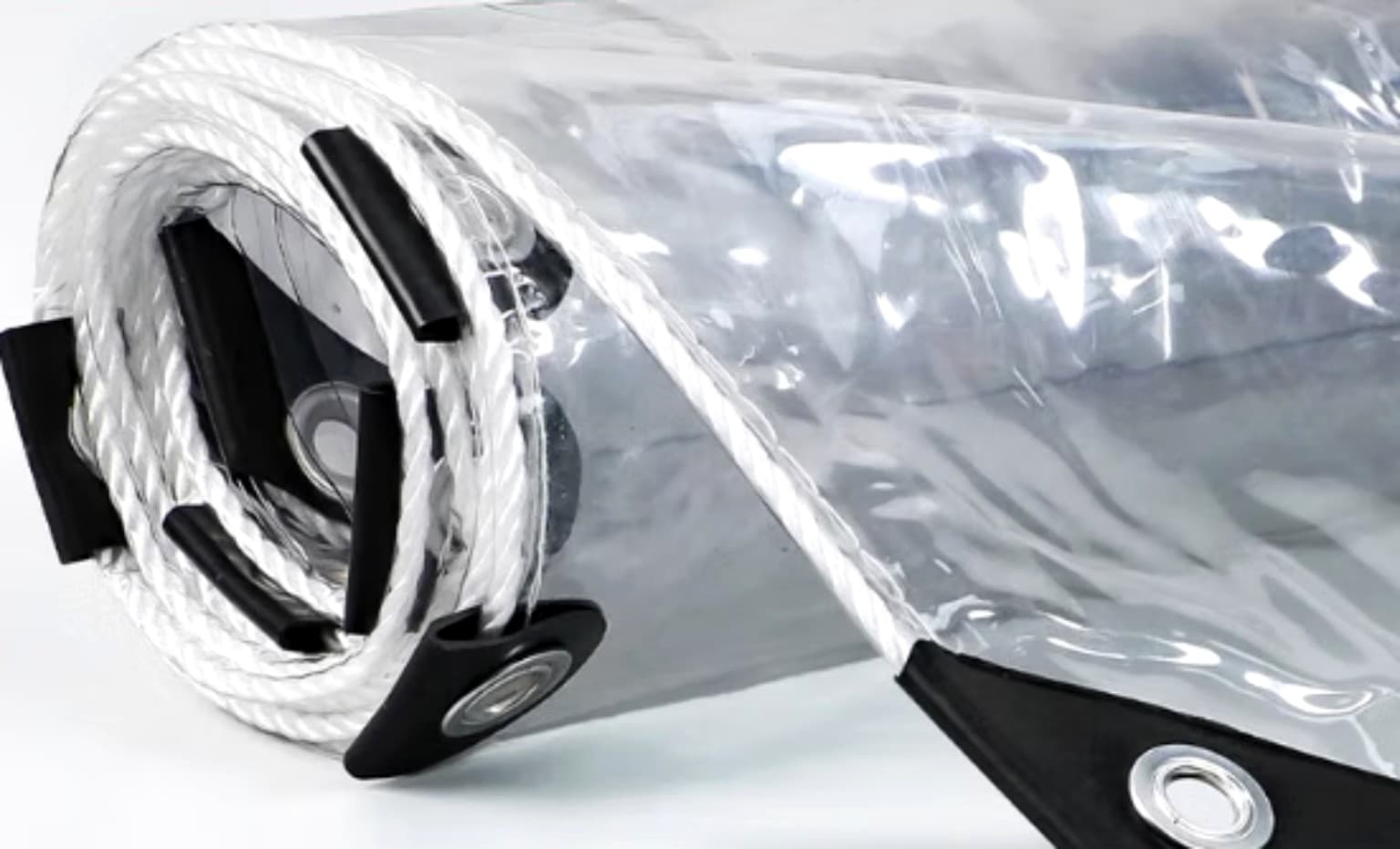 Transparent PVC tarpaulin rolled product and reinforced-edge context; exact thickness and sheet dimensions are stated in the product listing