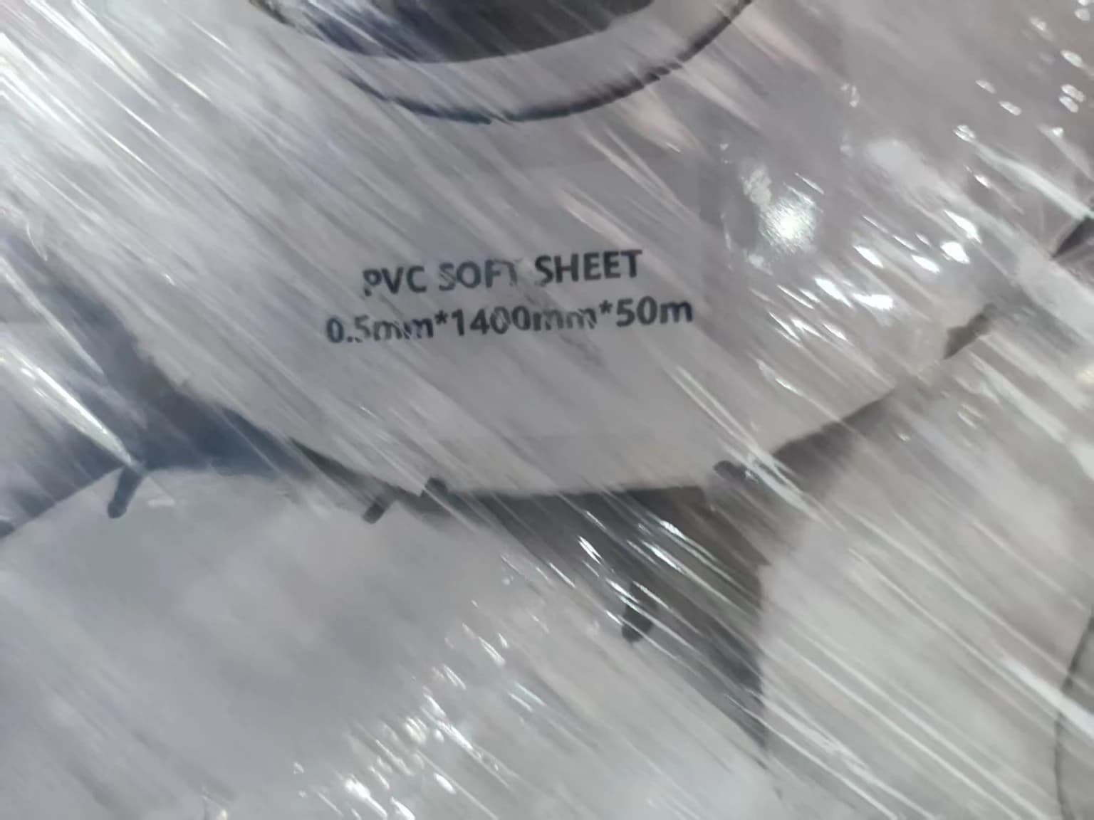 0.5mm x 1400mm x 50m clear PVC soft-film roll with specification label visible
